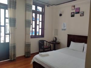 Postel nebo postele na pokoji v ubytování Minh Toàn Homestay