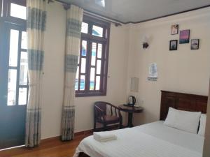 Postel nebo postele na pokoji v ubytování Minh Toàn Homestay