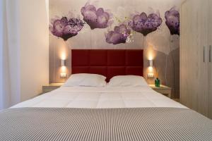 Postel nebo postele na pokoji v ubytování Hotel Stella D'Oro