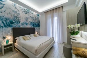Postel nebo postele na pokoji v ubytování Hotel Stella D'Oro