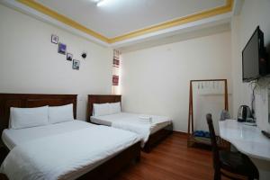 Postel nebo postele na pokoji v ubytování Minh Toàn Homestay
