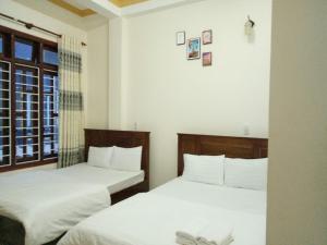 Postel nebo postele na pokoji v ubytování Minh Toàn Homestay