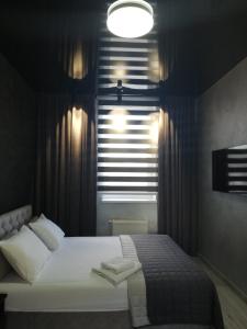 Postel nebo postele na pokoji v ubytování Prometey Hotel