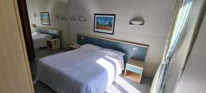 Llit o llits en una habitació de Hotel Ferrucci