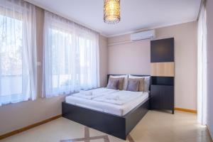 Posteľ alebo postele v izbe v ubytovaní MyFlat Belvedere Apartment
