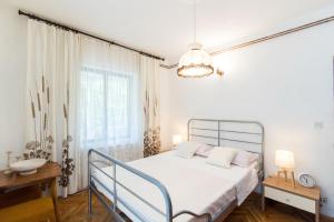 Ένα ή περισσότερα κρεβάτια σε δωμάτιο στο Apartments Mare