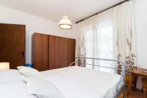 Ένα ή περισσότερα κρεβάτια σε δωμάτιο στο Apartments Mare +44 φωτογραφίες