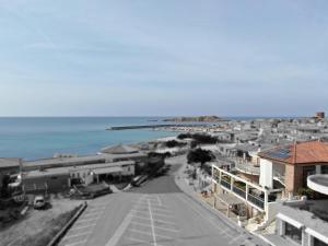 an aerial view of a city with the ocean at Holiday home Isola Rossa in Isola Rossa