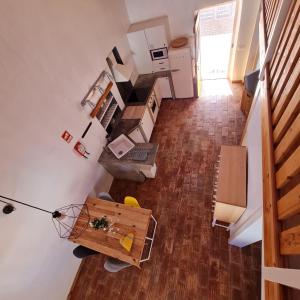 an overhead view of a room with a kitchen and a table at Casa Blanca in Odeceixe