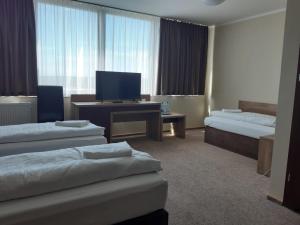 Posteľ alebo postele v izbe v ubytovaní Hotel Cargo