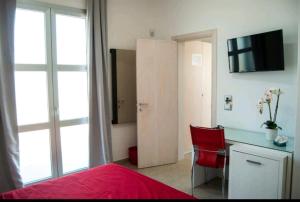 TV a/nebo společenská místnost v ubytování Exotic B&B