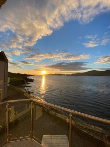 a view of a sunset over a body of water at No.21 Sandpiper's Nest Apartment in Valentia Island