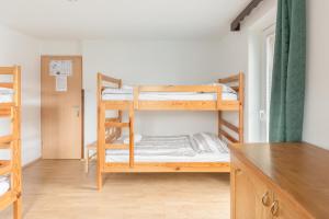Postel nebo postele na pokoji v ubytování Hostel Mama Minka