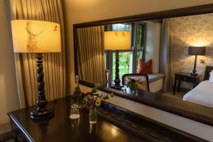 Voodi või voodid majutusasutuse BrookLodge & Macreddin Village toas