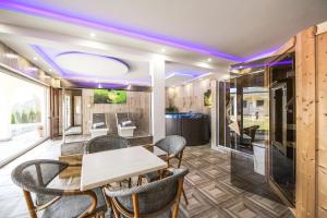 a dining room with a table and chairs at Sunčani Breg Apartments Vrdnik in Vrdnik