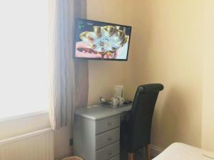 En TV eller et underholdningssystem på Esk Vale Guest House