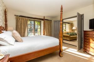 Voodi või voodid majutusasutuse BrookLodge & Macreddin Village toas