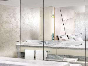 a bathroom with a mirror and a sink at Swissôtel Resort Bodrum Beach in Turgutreis