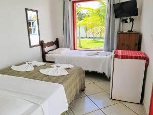 Postel nebo postele na pokoji v ubytování Jabaquara Beach Resort