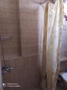 a shower with a shower curtain in a bathroom at Studio in Sharm El Sheikh