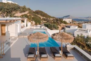 a view of a villa with umbrellas at Luxury Villa Akes - Elegance Home in Isterni