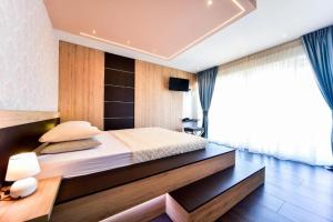 Ein Bett oder Betten in einem Zimmer der Unterkunft Aurora & Tramonto