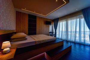 Ein Bett oder Betten in einem Zimmer der Unterkunft Aurora & Tramonto