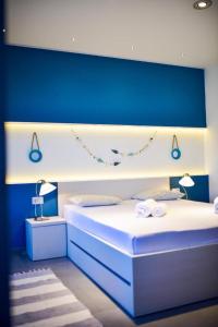 Ein Bett oder Betten in einem Zimmer der Unterkunft Aurora & Tramonto