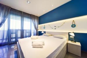Ein Bett oder Betten in einem Zimmer der Unterkunft Aurora & Tramonto