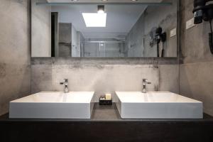 Ein Badezimmer in der Unterkunft Hotel Cittar