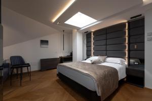 Ein Bett oder Betten in einem Zimmer der Unterkunft Hotel Cittar