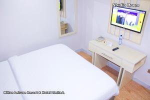 מיטה או מיטות בחדר ב-Hilton Leisure Resort