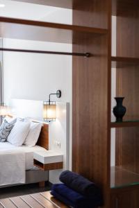 A bed or beds in a room at Sea View Suite "Hara" - Adults Only