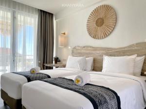 เตียงในห้องที่ Khaiyyara Jimbaran Bali