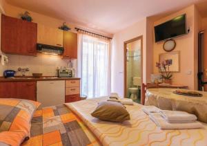a kitchen with a large bed in a room at Adria Vrsar in Vrsar
