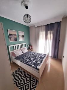 Cama ou camas em um quarto em Sweet Apartment