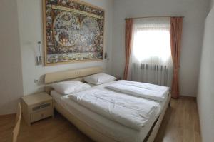 Posteľ alebo postele v izbe v ubytovaní Saskia Residence