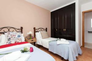 Postel nebo postele na pokoji v ubytování Casa Royal Park by Vacanzy Collection