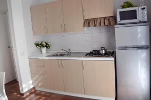 Kuchyňa alebo kuchynka v ubytovaní Favignana Casa Vacanza Orsola