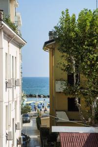 a view of the ocean from a balcony of a building at Villa Zavatta "B&B - Rooms & Apartments" in Bellaria-Igea Marina