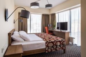 TV a/nebo společenská místnost v ubytování Hotel Sinchronas