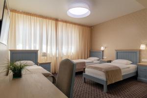 Postel nebo postele na pokoji v ubytování Hotel Sinchronas