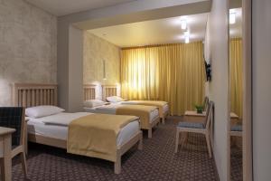 Postel nebo postele na pokoji v ubytování Hotel Sinchronas