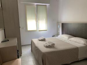 Postel nebo postele na pokoji v ubytování Hotel Chery