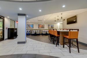 a dining room with a table and chairs at Alexis Inn and Suites Hotel in Nashville