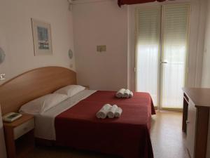 Postel nebo postele na pokoji v ubytování Hotel Chery