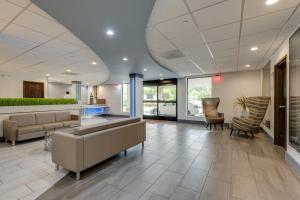 a lobby of a hospital with couches and chairs at Alexis Inn and Suites Hotel in Nashville