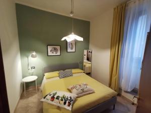 Postel nebo postele na pokoji v ubytování L'Angelo pellegrino miniappartamenti