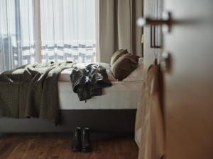 Ένα ή περισσότερα κρεβάτια σε δωμάτιο στο Boutique Apartment Sonnenhang - incl InfinityPOOL