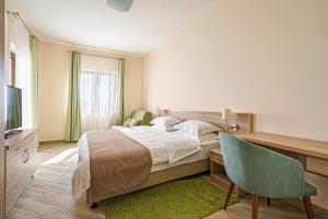 a bedroom with a bed and a desk and a chair at Villa Allende in Budva +87 photos